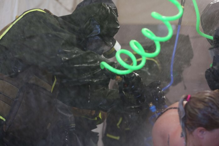 During the week-long training the platoons refined their skills in setup and breakdown of decontamination sites, decontamination of role players, and identification and detection of known agents in several scenarios including mass casaulty, radiation scenario and a subway scenario.  (Official USMC Photos by Staff Sgt. Santiago G. Colon Jr.)