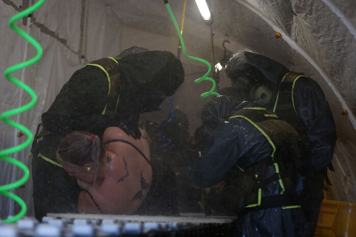 During the week-long training the platoons refined their skills in setup and breakdown of decontamination sites, decontamination of role players, and identification and detection of known agents in several scenarios including mass casaulty, radiation scenario and a subway scenario.  (Official USMC Photos by Staff Sgt. Santiago G. Colon Jr.)