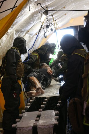 During the week-long training the platoons refined their skills in setup and breakdown of decontamination sites, decontamination of role players, and identification and detection of known agents in several scenarios including mass casaulty, radiation scenario and a subway scenario.  (Official USMC Photos by Staff Sgt. Santiago G. Colon Jr.)