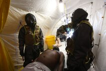 During the week-long training the platoons refined their skills in setup and breakdown of decontamination sites, decontamination of role players, and identification and detection of known agents in several scenarios including mass casaulty, radiation scenario and a subway scenario.  (Official USMC Photos by Staff Sgt. Santiago G. Colon Jr.)