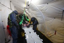 During the week-long training the platoons refined their skills in setup and breakdown of decontamination sites, decontamination of role players, and identification and detection of known agents in several scenarios including mass casaulty, radiation scenario and a subway scenario.  (Official USMC Photos by Staff Sgt. Santiago G. Colon Jr.)