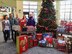 From left, Kate Gorski, Minnesota Veteran's Home; Lt. Col. Karen Rowe, 934 FSS; Master Sgt. Eric Amidon, 934 AW/PA; Christa Michel, MN Vets Home; and Rick Pelzl, 934 FSS; stand with the gifts donated by the Airmen of the 934th Airlift Wing. (Air Force Photo/Paul Zadach)