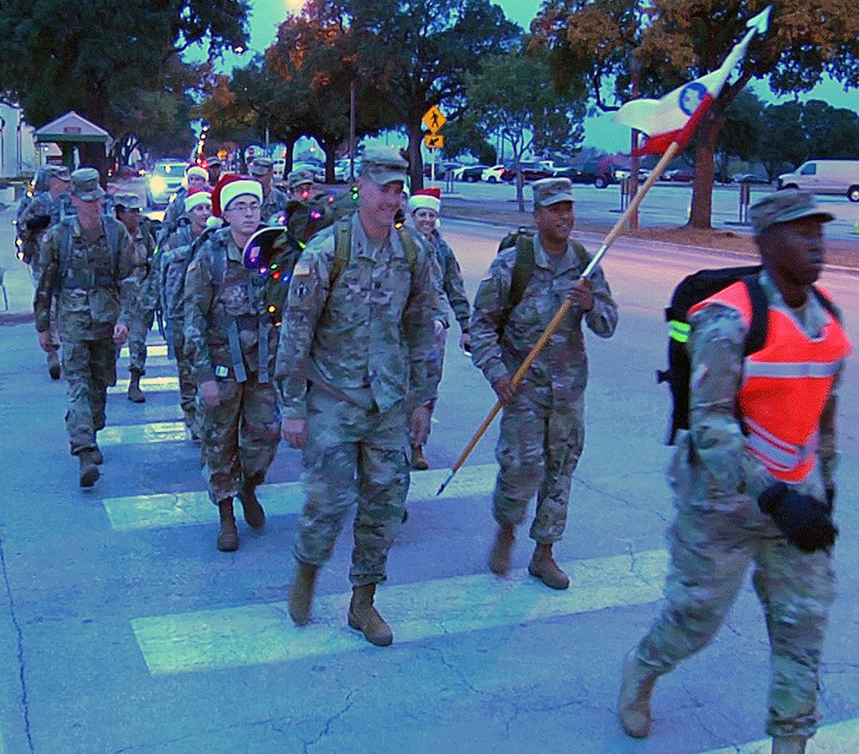 Soldiers from the U.S. Army South Headquarters Support Company head to the Joint Base San Antonio-Fort Sam Houston Child Development Center to deliver toys during their first toy ruck march Dec. 14.