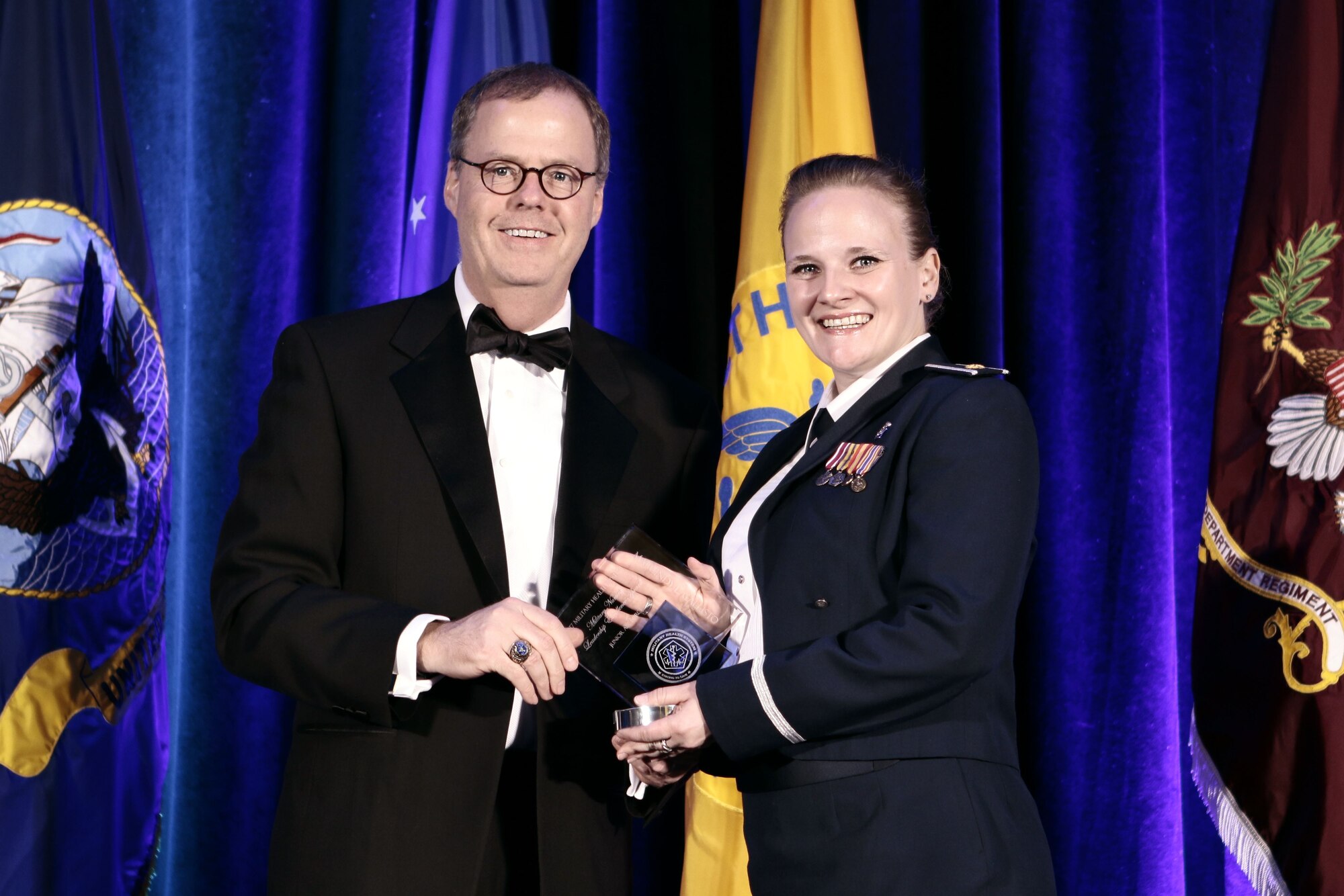 Maj. Cindy Callisto, 377 Medical Group nurse practitioner, accepts the award for Top Air Force Nurse.