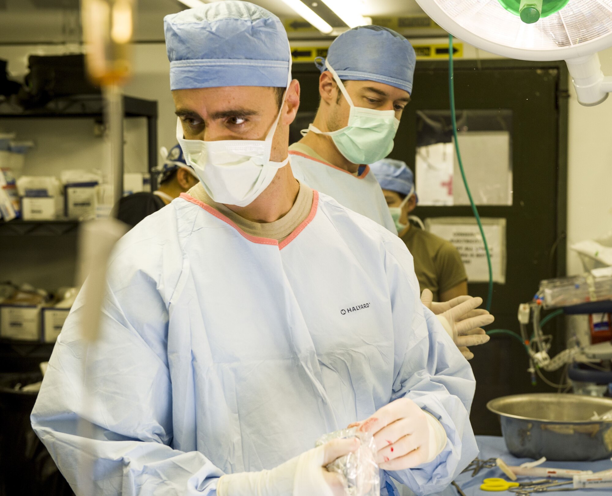 Dr. (Maj.) Jeffrey DellaVolpe, an Individual Mobilization Augmentee, works to place a Navy explosive ordnance disposal technician on extracorporeal membrane oxygenation therapy, or ECMO for short. The procedure, which artificially oxygenates the blood, stabilized the sailor's body, allowing him to be transported directly from Baghdad to the San Antonio Military Medical Center at Joint Base San Antonio-Fort Sam Houston.