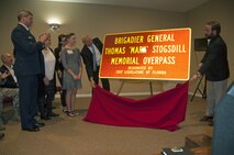 Family members of the late Brig. Gen. Thomas “Mark” Stogsdill witness state officials unveiling a sign dedicating to his memory.