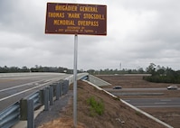 A freshly installed sign dedicated to the memory of the late Brig. Gen. Thomas “Mark” Stogsdill stands above the Florida State Road 85 overpass