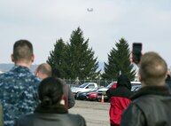 Members of Naval Medical Research Unit-Dayton watch a Marine Corps MV-22 Osprey approach over Wright-Patterson Air Force Base, Ohio, Dec. 19, 2017. NAMRU-D was acquiring the aircraft for use in medical research with the goal of minimizing injuries to aircrew members and maintenance workers. (U.S. Air Force photo by R.J. Oriez)