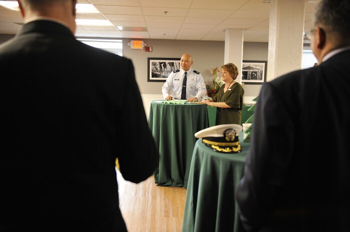U.S. Air Force Col. Jimmy Canlas, 437th Airlift Wing commander, expresses his appreciation to attendees through a speech Dec. 15, 2017, at Coast Guard Sector Charleston’s Brass Buckle conference room.