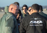 U.S. Air Force Chief Master Sgt. Frank Batten, command chief of Air Combat Command, speaks with the F-22 Raptor Demonstration Team during a performance at Joint Base Langley-Eustis, Va., Dec. 18, 2017.