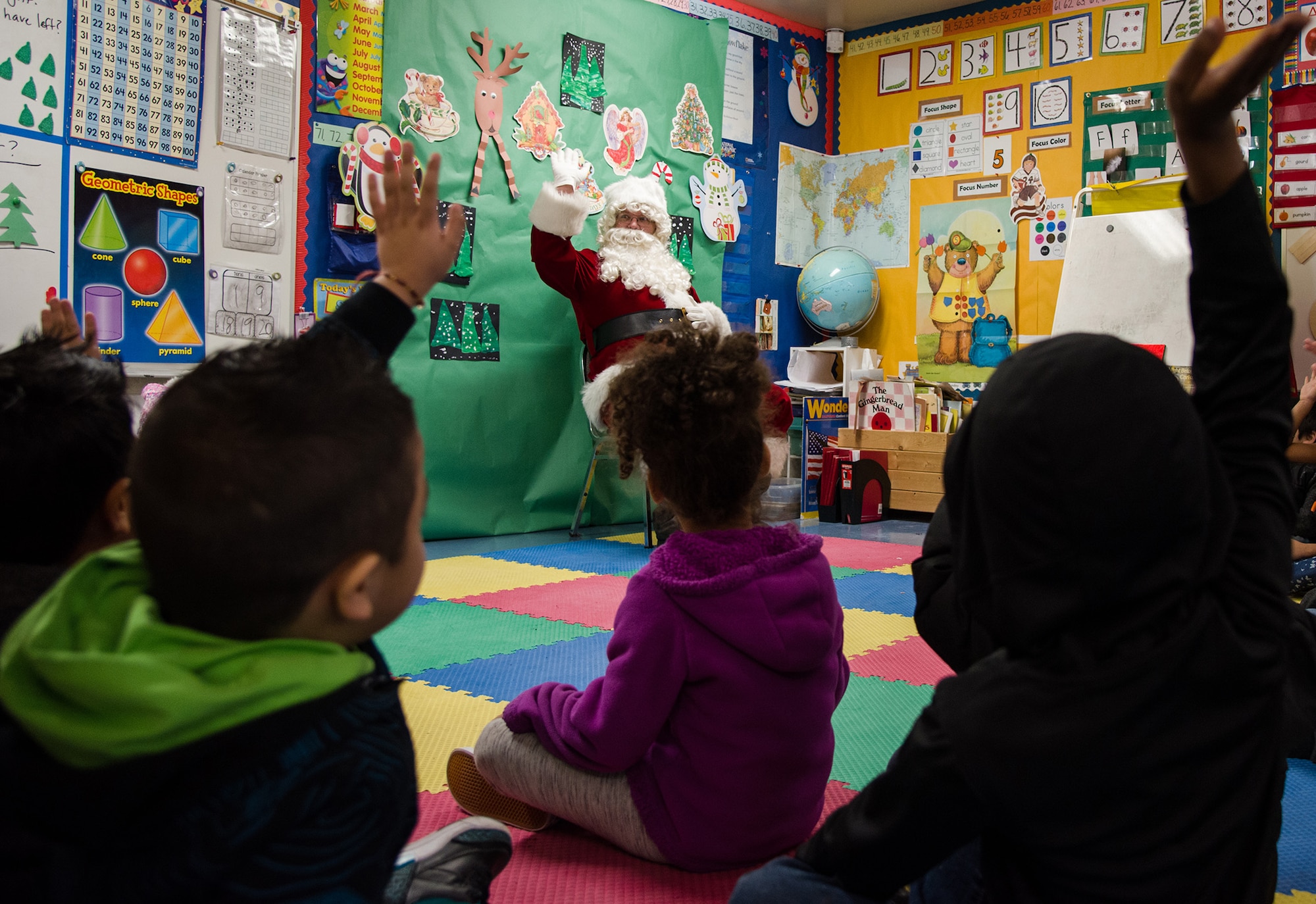 Since the 1980’s members of the 349th Air Mobility Wing, along with Team Travis members, have participated in Operation Teddy Bear. This year, the 349th Medical Group hosted the event as Airmen visited local Solano County kindergarten children and distributed almost 500 gift bags filled with Teddy bears, candy canes, juice boxes, toys, and pencils. The children also got to visit with Santa Clause himself! (U.S. Air Force photo / Staff Sgt. Daniel Phelps)