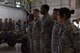 Airmen assigned to the 432nd Aircraft Maintenance Squadron Reaper and Tiger Aircraft Maintenance Units wait for competition results after a weapons load competition Dec. 8, 2017, at Creech Air Force Base, Nev. Teams from the Tiger and Reaper AMUs compete against one another every quarter to maintain efficiency and earn the Load Crew of the Quarter title. (U.S. Air Force photo by Airman 1st Class Haley Stevens)