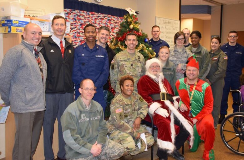 Local service members from the U.S. Army Corps of Engineers, Buffalo District, U.S. Coast Guard Sector Buffalo, Niagara Falls Air Reserves Station and the Buffalo Military Entrance Processing Station delivered holiday cards and visited with veterans of the Veterans Affairs Adult Day Health Care center, Dec. 20, 2017.