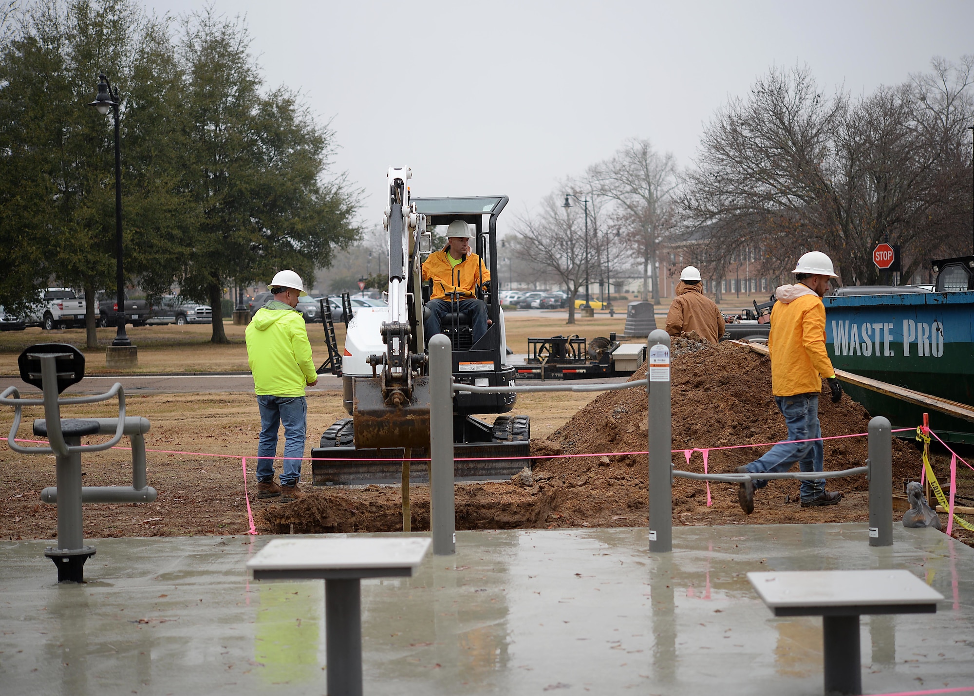 Contractors from J.A. Dawson & Co. prepare to install an awning over a new fitness station on the Fit Trail Dec. 19, 2017, on Columbus Air Force Base, Mississippi. The 14th Force Support Squadron, 14th Civil Engineer Squadron and the 14th Contracting Squadron work hand in hand to provide Columbus AFB service members and families with equipment and opportunities they can use to enhance their quality of life. (U.S. Air Force photo by Airman 1st Class Keith Holcomb)