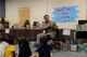 Staff Sgt. Jaymie Depina, 14th Flying Training Wing Equal Opportunity specialist, reads a book to children at West Lowndes Elementary School Dec. 20, 2017, in Columbus, Mississippi. Members from Columbus Air Force Base, Mississippi, donated over 500 books to children and the school. (U.S. Air Force photo by Airman 1st Class Beaux Hebert)