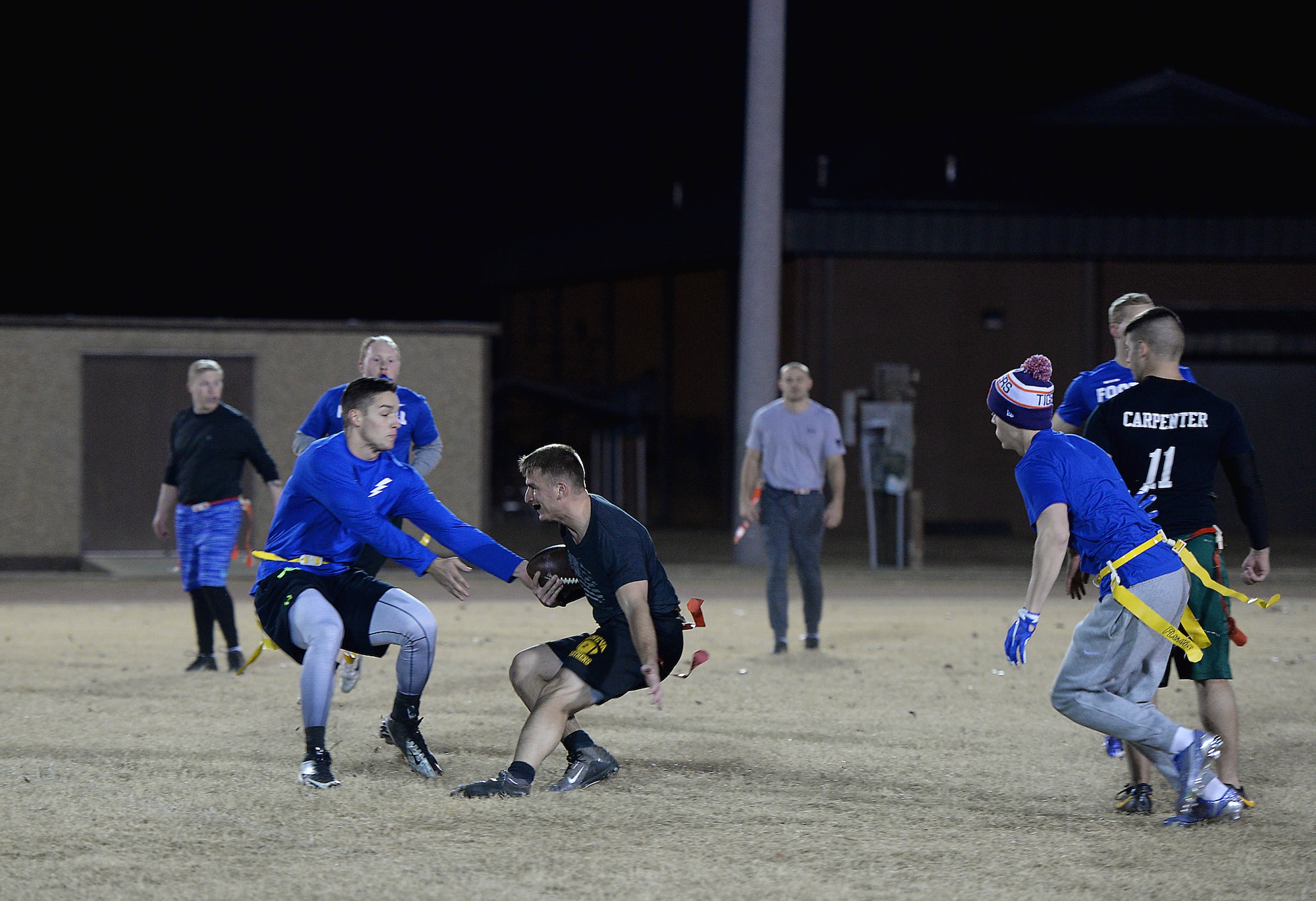 Staff Sgt. Nicholas Bahr, 14th Operations Support Squadron, makes his way through defenders on his way to the end zone Dec. 14, 2017, on Columbus Air Force Base, Mississippi, during the Columbus AFB intramural flag football championship. The final game was a back-and-forth between the two top squadrons on base, the 14th OSS and the 14th Student Squadron. The OSS won by a score of 20-7.  (U.S. Air Force photo by Airman 1st Class Keith Holcomb)