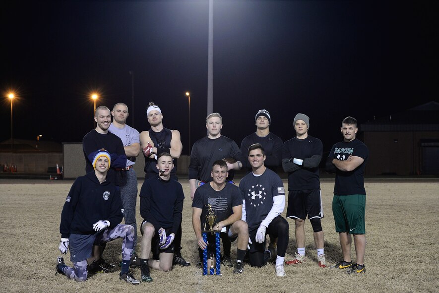 The 14th Operations Support Squadron flag football team poses after winning the Columbus Air Force Base intramural flag football championship Dec. 14, 2017, on Columbus AFB, Mississippi. The 14th OSS beat the 14th Student Squadron by a score of 20-7. (U.S. Air Force photo by Airman 1st Class Keith Holcomb)