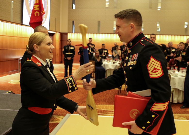 Maj. Nicole Bastian, commanding officer of Marine Corps Recruiting Command/Recruiting Station St. Louis presents Gunnery Sgt. Shane Greer with his award during the 242nd Marine Corps Birthday Ball at Lumiere Place Casino and Hotel, St. Louis, Missouri, Nov. 10. Greer, recruiter with Recruiting Sub Station Mount Vernon was awarded the RS Recruiter of the Year 2017 for RS St. Louis.