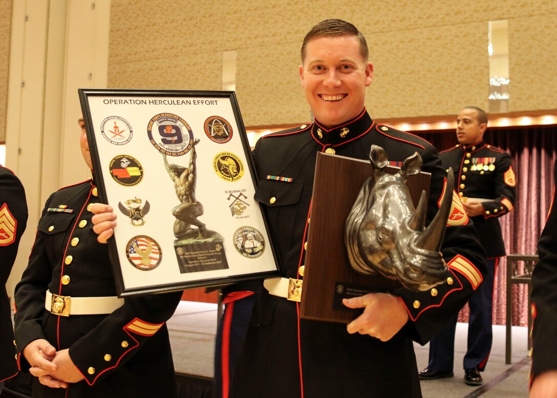 Staff Sgt. Ryan Payne smiles after he is presented his award during the 242nd Marine Corps Ball at Lumiere Place Casino and Hotel, St. Louis, Missouri, Nov. 10.  Payne, the Staff NonCommissioned Officer in Charge of Recruiting Sub Station Mount Vernon, was awarded the SNCOIC of the Year award 2017 for Marine Corps Recruiting Command/Recruiting Station St. Louis. (US Marine Corps photo by Cpl. Harley Robinson)