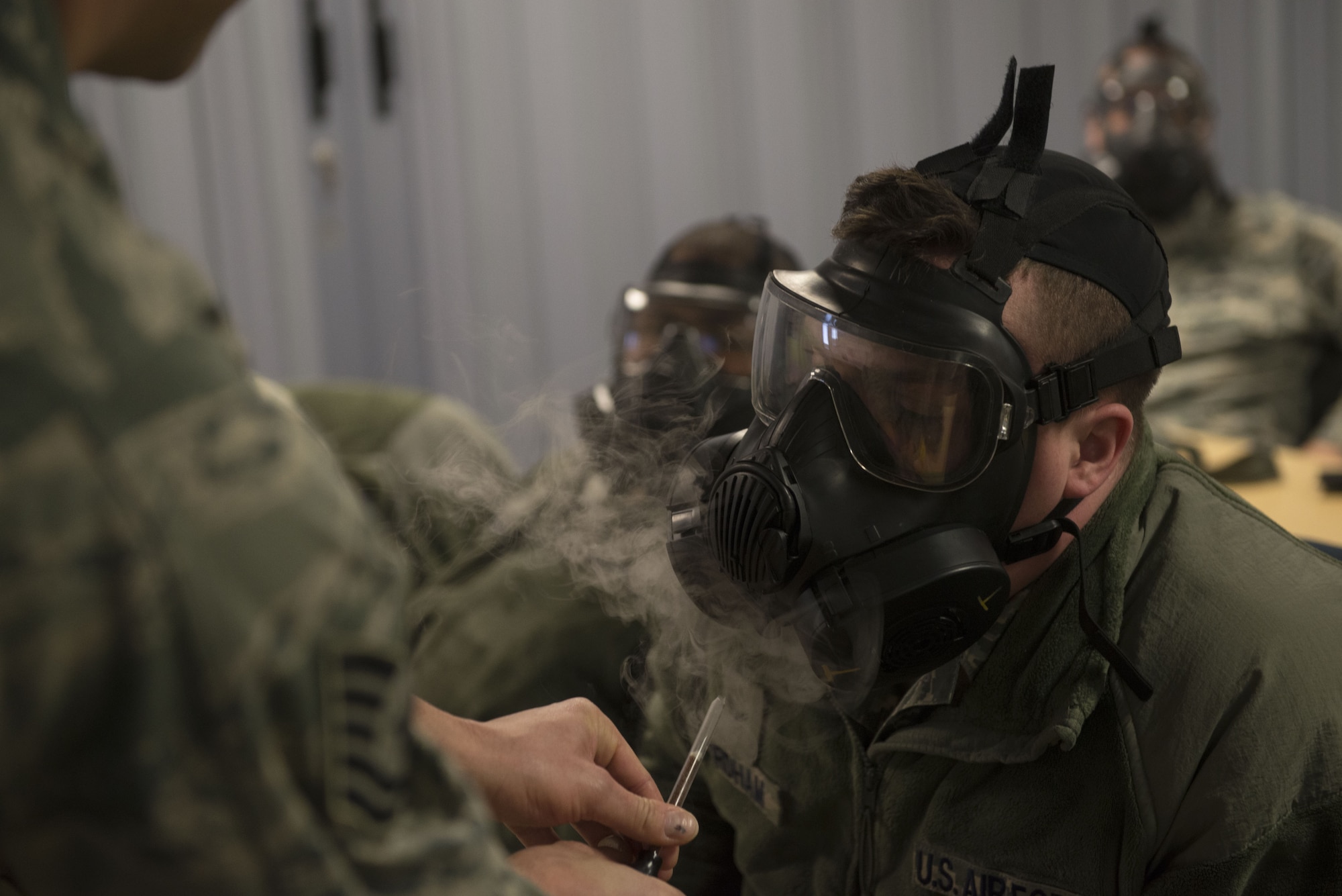 A 366th Fighter Wing Airman undergoes mask confidence training during chemical, biological, radiological, nuclear and explosives training Dec. 20, 2017, at Mountain Home Air Force Base, Idaho. CBRNE training prepares Airmen to survive and work in a harmful environment anywhere in the world. (U.S. Air Force photo by Airman 1st Class JaNae Capuno)