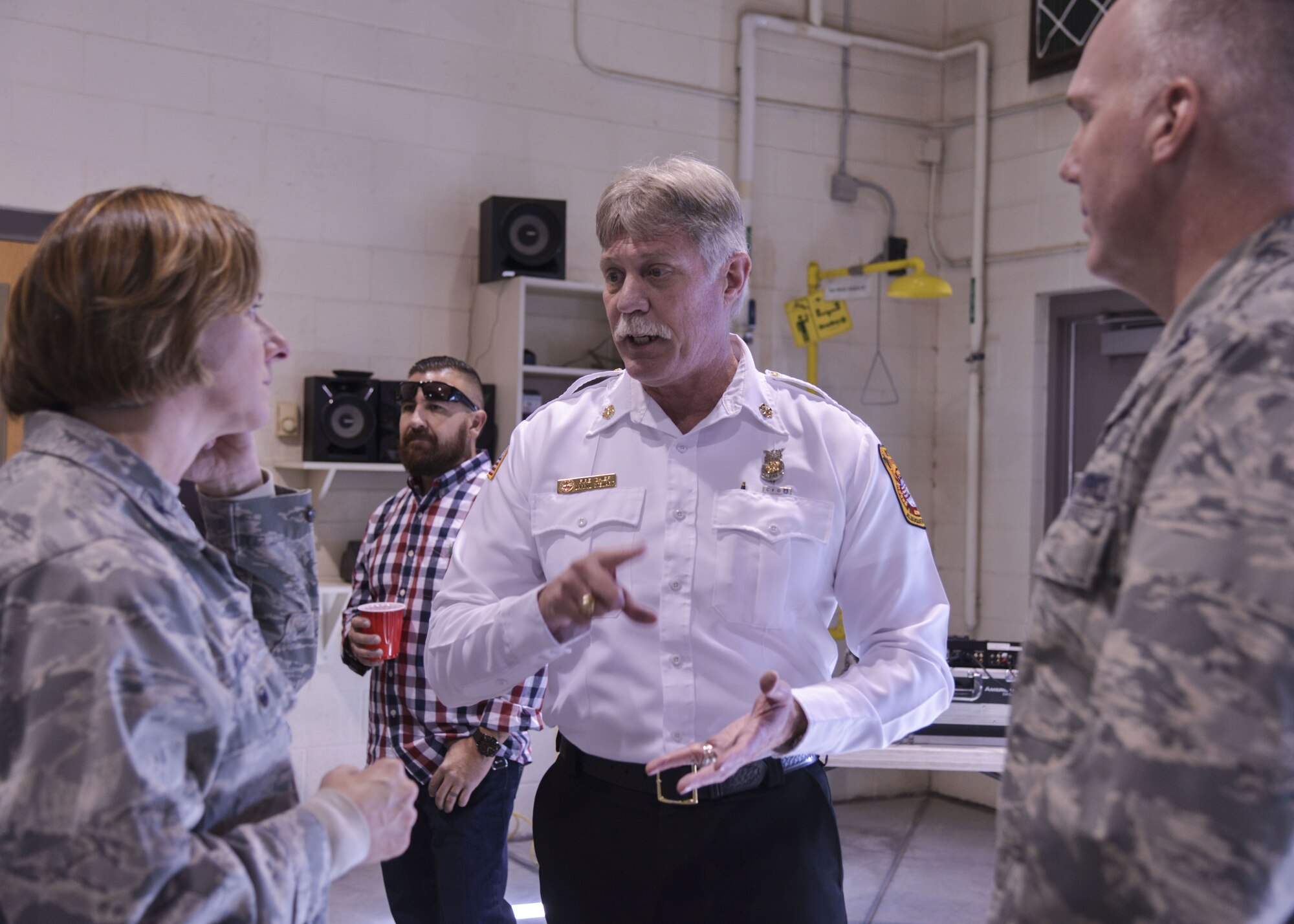 Fire Chief Darryl Stewart, chief of the Kirtland Fire Department, helped put on Operation Holiday Cheer on Dec. 20 at Kirtland Air Force Base, New Mexico. This event helps families in need by giving them a full holiday meal and a visit with Santa, and sending the children home with gifts.