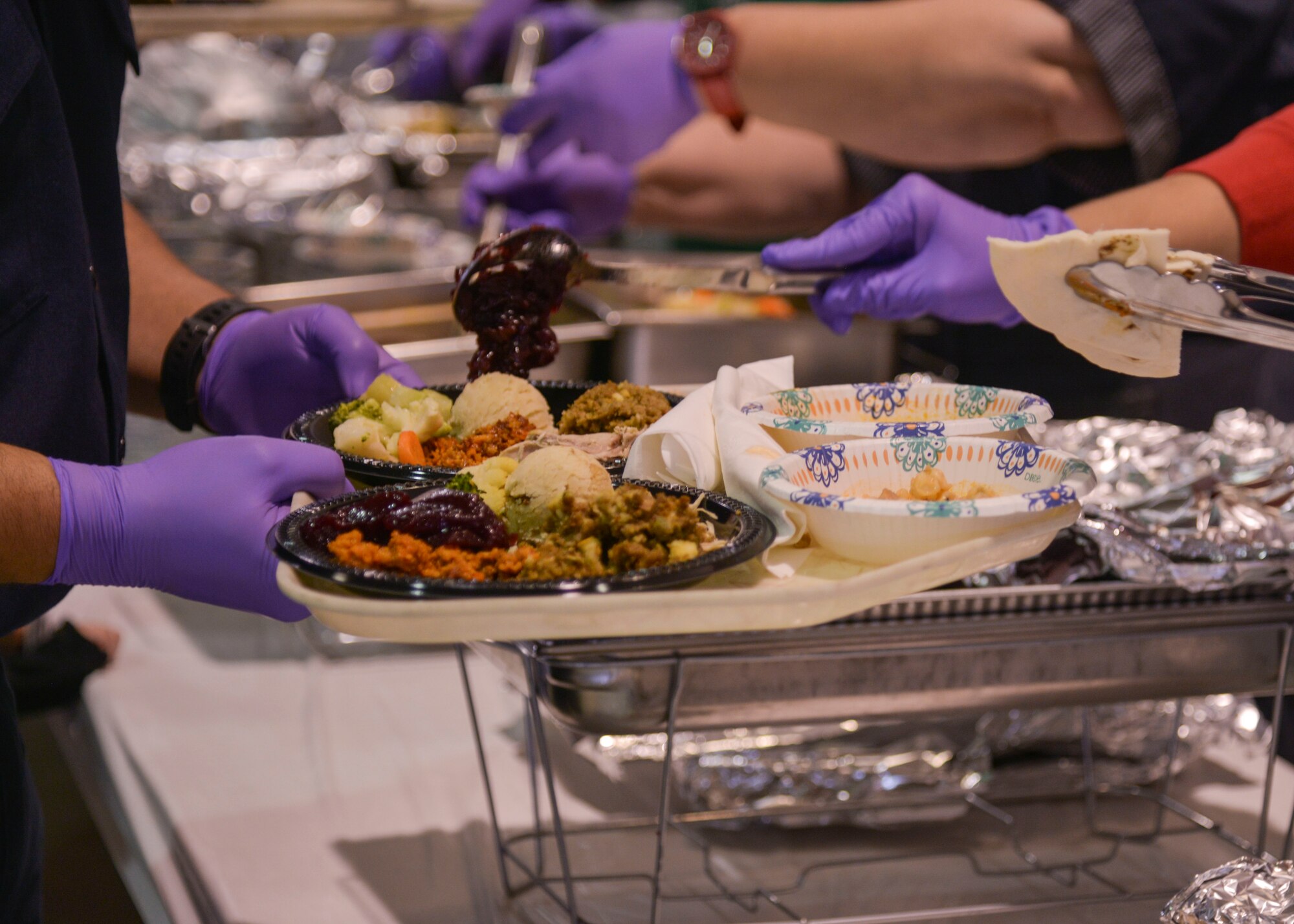 The Kirtland Fire Department hosted the 39th annual Operation Holiday Cheer on Dec. 20 at Kirtland Air Force Base, New Mexico. This event helps families in need by giving them a full holiday meal and a visit with Santa, and sending the children home with gifts.