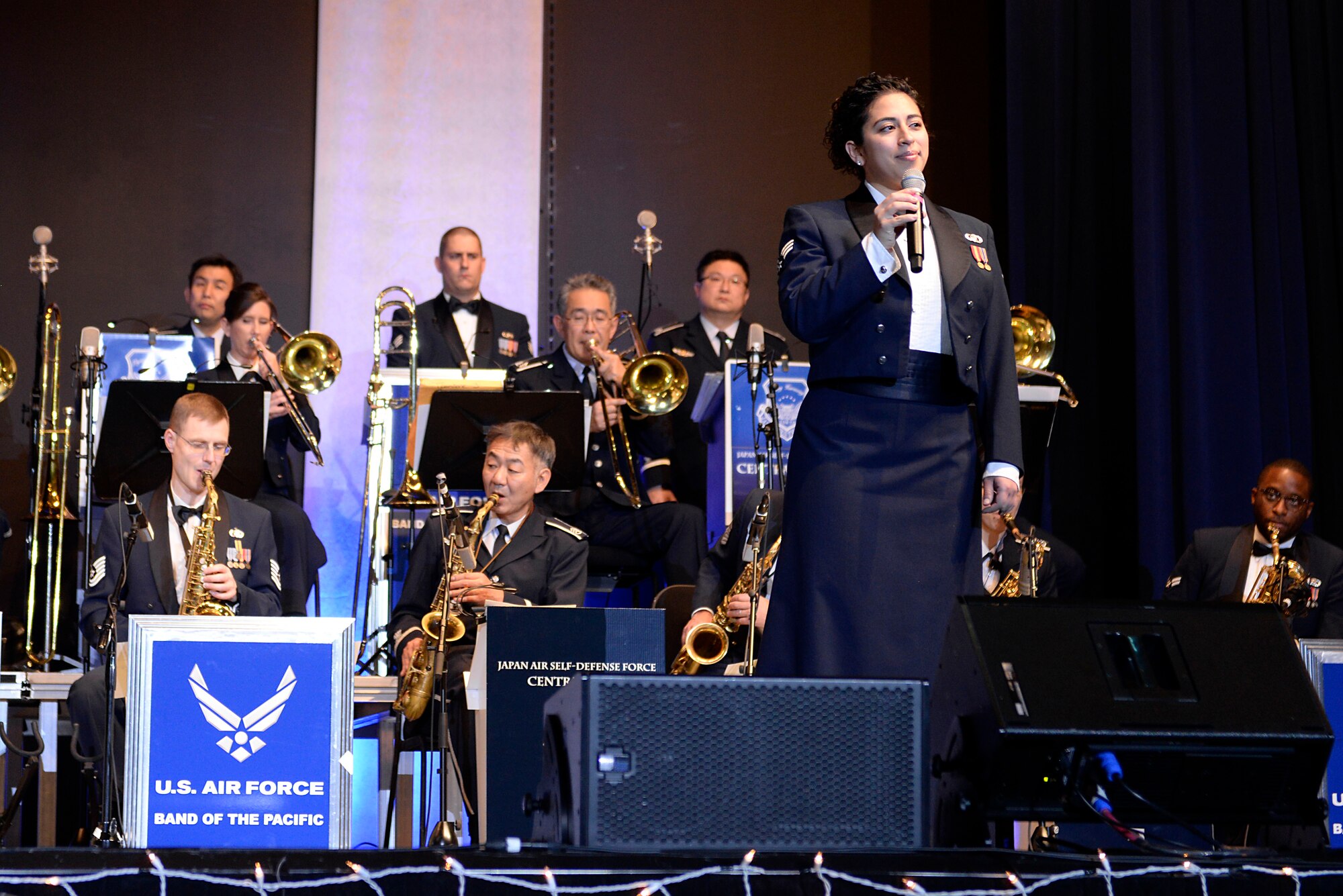 U.S. Air Force Senior Airman Alycia Cancel, U.S. Air Force Band of the Pacific vocalist, sings lead during the Sounds of the Season concert, Dec. 19, 2017, at Yokota Air Base, Japan.