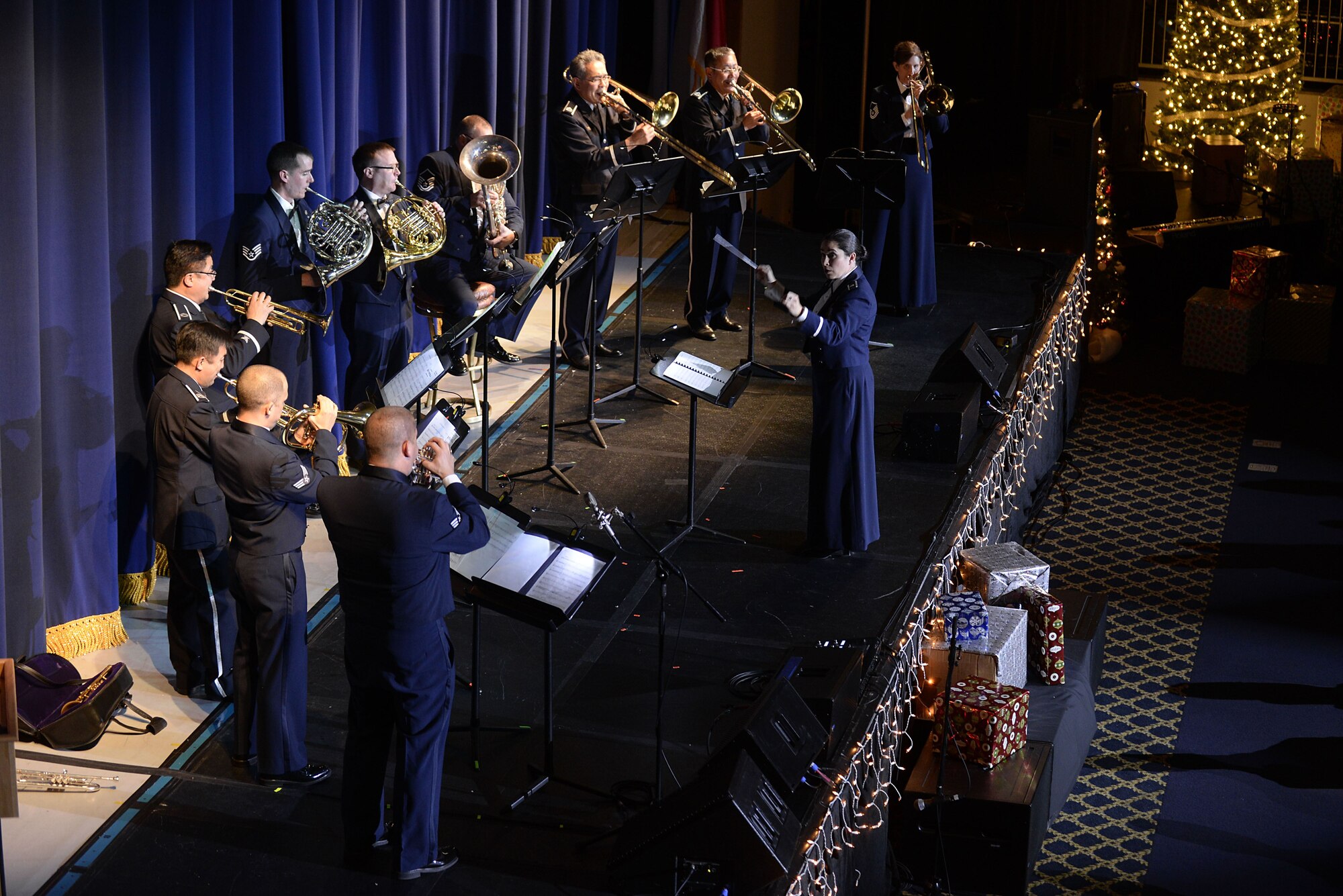 U.S. Air Force Lt. Col. Cristina Moore Urrutia, U.S. Air Force Band of the Pacific commander, conducts members of the PACAF Band and Koku Jietai Central Band during the Sounds of the Season concert, Dec. 19, 2017, at Yokota Air Base, Japan.