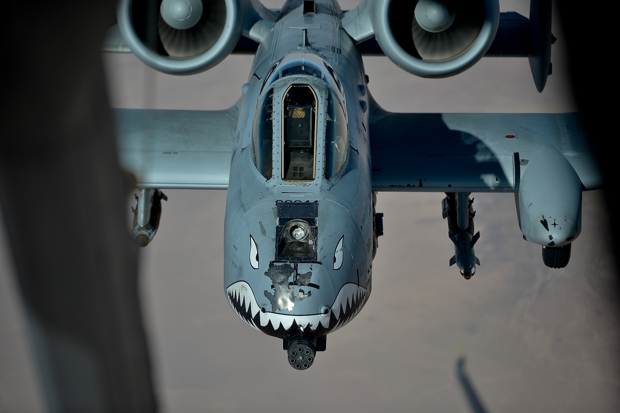 A U.S. Air Force A-10 Thunderbolt II pilot, currently assigned to the 332nd Air Expeditionary Wing, approaches a KC-10 Extender before an aerial refuel over Iraq Dec. 2, 2017. The A-10 has a wide combat radius and short takeoff and landing capability allowing for it to permit operations in and out of locations near front lines. (U.S. Air Force photo by Tech. Sgt. Anthony Nelson Jr.)