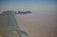 A U.S. Air Force A-10 Thunderbolt II pilot, currently assigned to the 332nd Air Expeditionary Wing, waits for his wingman to be refueled by a KC-10 Extender over Iraq Dec. 2, 2017. An A-10 can employ a wide variety of conventional munitions, including general purpose bombs, cluster bomb units, laser guided bombs, joint direct attack munitions and more. 
 (U.S. Air Force photo by Tech. Sgt. Anthony Nelson Jr.)