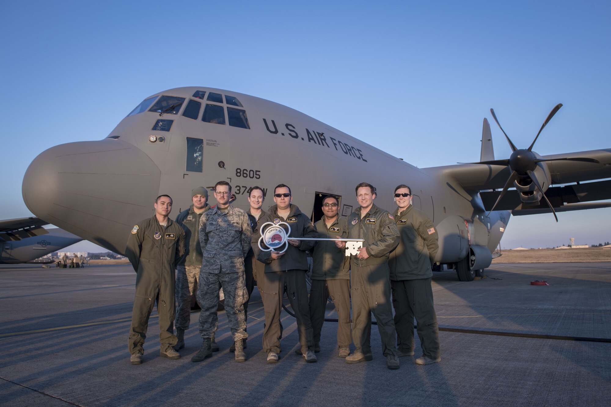 Members of the C-130J Super Hercules number 8605 delivery team pose for a photo, Dec. 21, 2017, at Yokota Air Base, Japan.