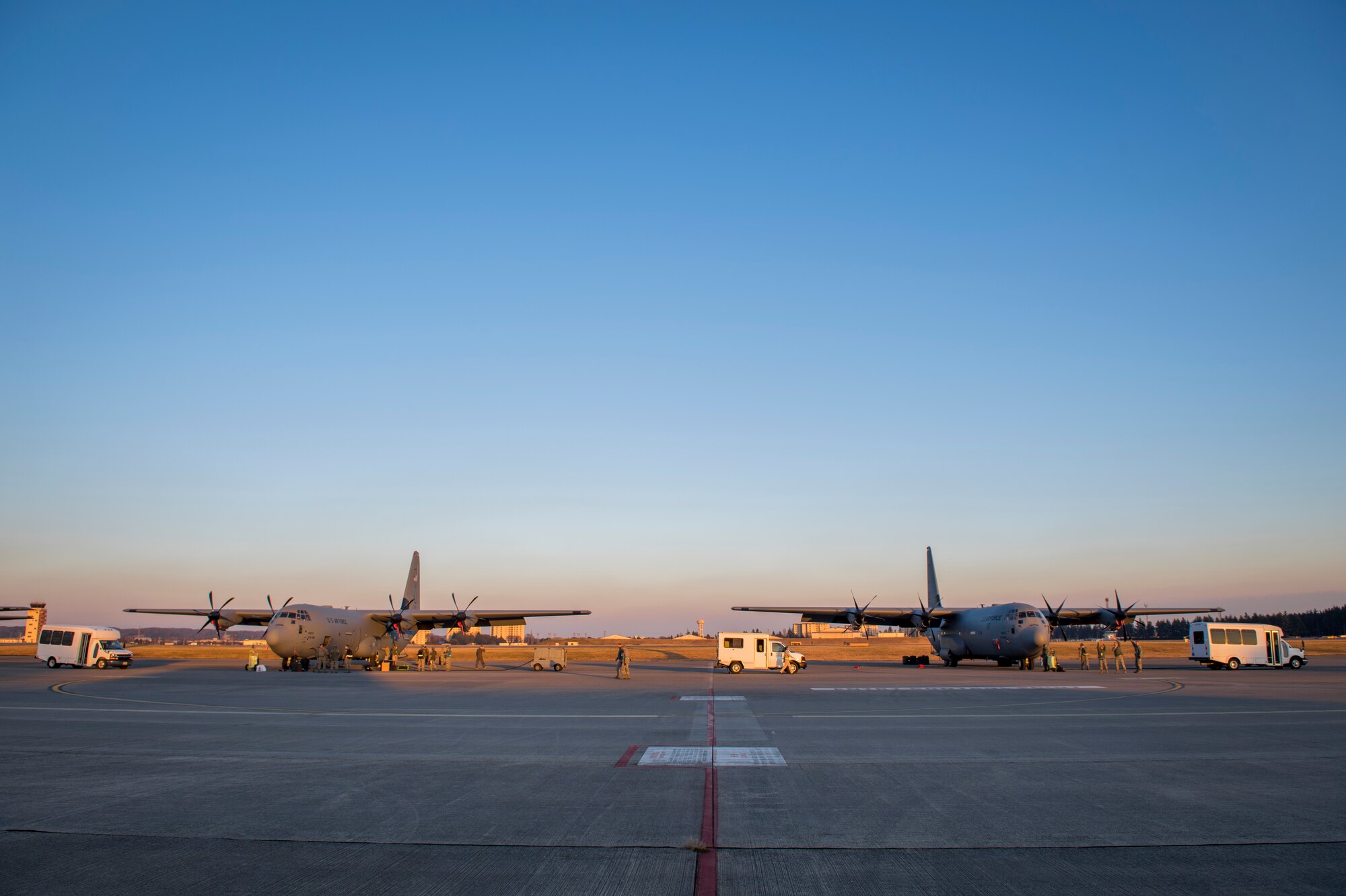 Two C-130J Super Hercules sit on the flightline, Dec. 21, 2017, at Yokota Air Base, Japan.
