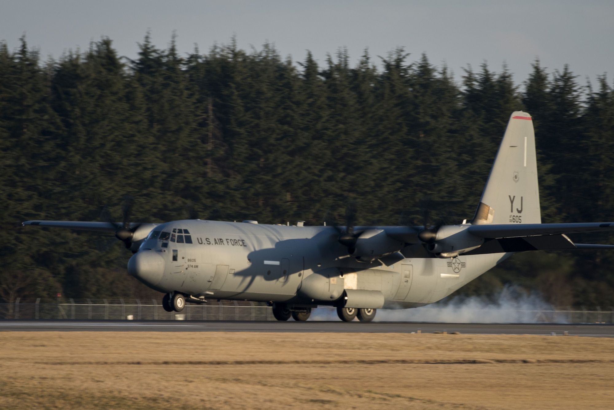 A C-130J Super Hercules lands on the runway, Dec. 21, 2017, at Yokota Air Base, Japan.