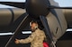 A 374th Maintenance Group Airman gives a thumbs up after inspecting a C-130J Super Hercules intake, Dec. 21, 2017, at Yokota Air Base, Japan.