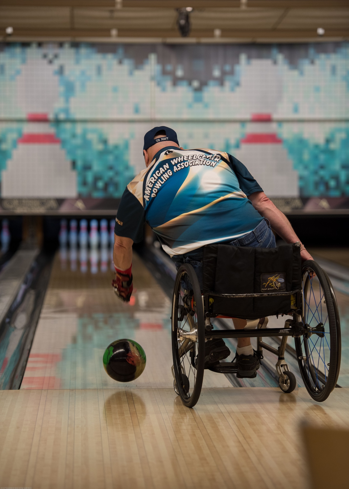 Dave Nelson Jr., a retired U.S. Navy anti-submarine warfare operator and search and rescue swimmer, bowls during an event hosted by the Office of the Warrior Advocate at Offutt Air Force Base, Nebraska, Dec. 21, 2017. The OWA reached out to many organizations in the Omaha and Offutt community to share what resources are available on base for Wounded Worriors, disabled veterans and their families through bowling. (U.S. Air Force photo by Senior Airman Jacob Skovo)