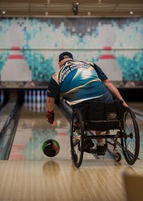 Dave Nelson Jr., a retired U.S. Navy anti-submarine warfare operator and search and rescue swimmer, bowls during an event hosted by the Office of the Warrior Advocate at Offutt Air Force Base, Nebraska, Dec. 21, 2017. The OWA reached out to many organizations in the Omaha and Offutt community to share what resources are available on base for Wounded Worriors, disabled veterans and their families through bowling. (U.S. Air Force photo by Senior Airman Jacob Skovo)