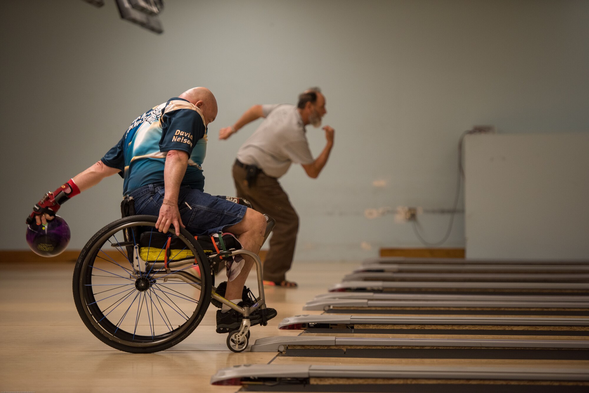 Dave Nelson Jr., a retired U.S. Navy anti-submarine warfare operator and search and rescue swimmer, bowls during an event hosted by the Office of the Warrior Advocate at Offutt Air Force Base, Nebraska, Dec. 21, 2017. The OWA reached out to many organizations in the Omaha and Offutt community to share what resources are available on base for Wounded Worriors, disabled veterans and their families through bowling. (U.S. Air Force photo by Senior Airman Jacob Skovo)