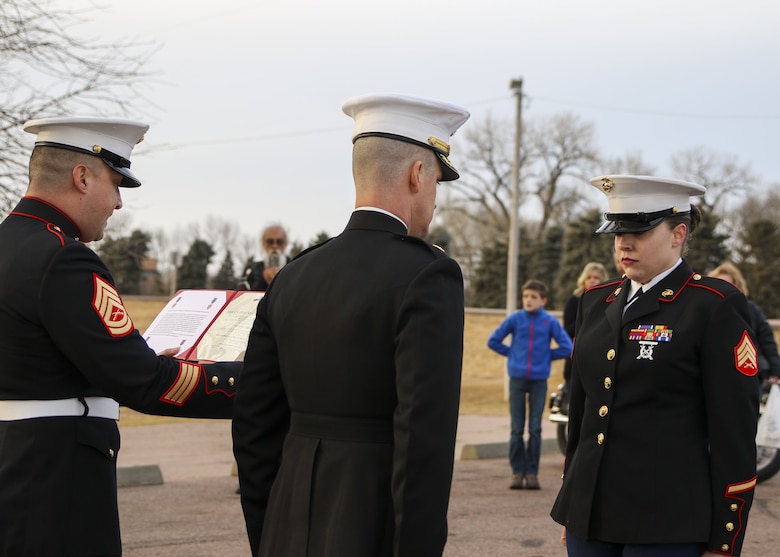 Sergeant Sara McGaffee, a Sioux Falls, S.D., native, receives a Purple Heart Medal, Dec. 16, in front of a detail of Marines and her local friends and family. On Oct. 20th, 2010, while deployed with Combat Logistics Battalion 3, McGaffee’s vehicle was hit by an improvised explosive device while conducting convoy operations in support of Operation Steel Dawn II in the Helmand province of Afghanistan.