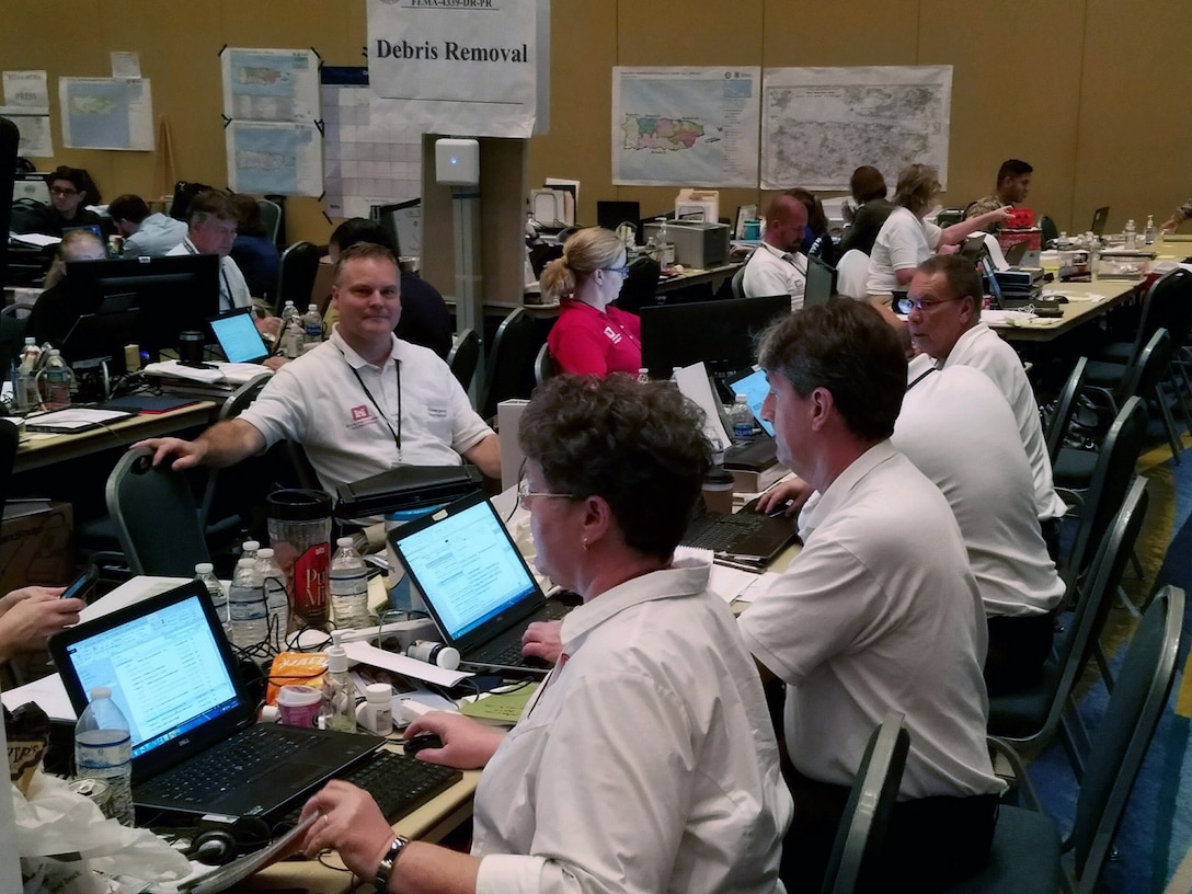 A group of first responders working in an emergency operations center.