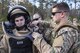 Senior Airman Trenton Broxterman, right, 23d Civil Engineer Squadron (CES) Explosive Ordinance Disposal (EOD) apprentice, adjusts a body suit for Tech Sgt. Nick Adkisson, 23d CES EOD team leader, during a response training exercise, Dec 21, 2017, at Moody Air Force Base, Ga.  The EOD Airmen were evaluated on their ability to respond to a distress call, locate, identify and neutralize an improvised explosive device. (U.S. Air Force photo by Airman Eugene Oliver)