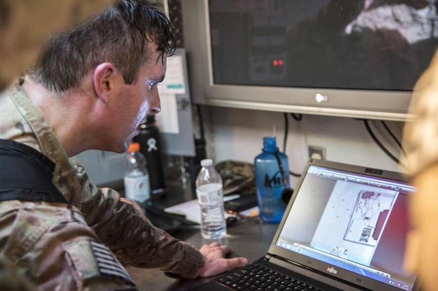 Tech Sgt. Nickolas Adkisson, 23d Civil Engineer Squadron (CES) Explosive Ordinance Disposal (EOD) team leader, examines a computer screen during a response training exercise, Dec. 21, 2017, at Moody Air Force Base, Ga. The EOD Airmen were evaluated on their ability to respond to a distress call, locate, identify and neutralize an improvised explosive device. (U.S. Air Force photo by Airman Eugene Oliver)
