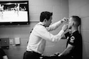 Dr. (Col.) Gregory Hsu, right, treats facial injuries on UFC fighters following their bouts in the octagon. Hsu is an ophthalmologist who also serves in the Air Force as the Individual Mobilization Augmentee to the Pacific Air Forces Surgeon General.