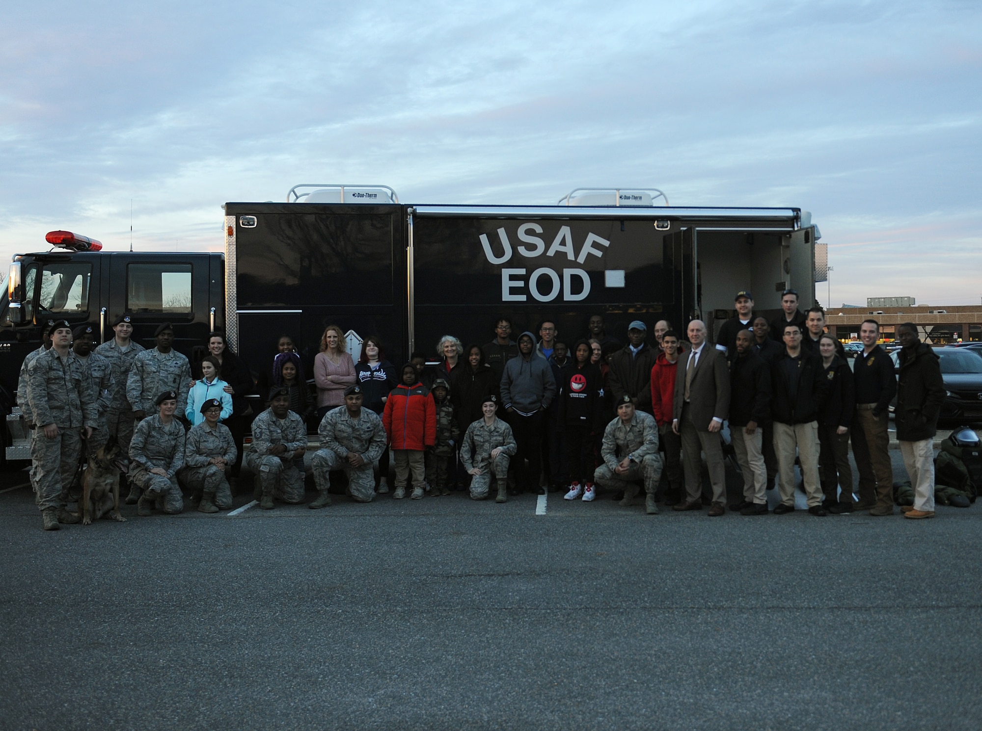 U.S. Air Force service members pose with local youth from The Up Center’s Team Up mentoring program, a non-profit organization in Hampton Roads, during the “Shop with a Cop” event at Joint Base Langley-Eustis, Va., Dec. 19, 2017.