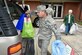Senior Master Sgt. Charles Hoyt, with the AEDC Arnold Air Force Base Test Systems Sustainment Division, and a community volunteer collect the toys and clothing donated through this year’s Arnold AFB Angel Tree program. The items provided by base personnel will go to 143 area children. (U.S. Air Force photo/Rick Goodfriend)