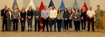 Troop Support's Special Operational Equipment Tailored Logistics Support Program team poses with Troop Support Commander, Army Brig. Gen Mark Simerly during the Dec. 19 quarterly awards ceremony.