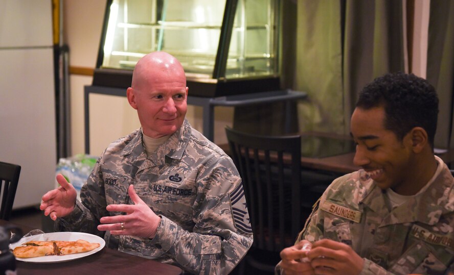 Chief Master Sgt. Thomas Good, 20th Air Force command chief, speaks with  Airman 1st Class Damarius Saunders, Dec. 19, 2017, at a missile alert facility, in the 90th Missile Wing missile complex. Good sat down with the Airmen at the MAF for dinner and talked about many things from the importance of their mission to the importance of education. (U.S. Air Force photo by Airman 1st Class Braydon Williams)