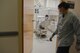 Airman 1st Class Amy Demitre, 90th Medical Group dental assistant, returns to her patient after taking an x-ray of a crowned tooth at the dental clinic on F.E. Warren Air Force Base, Wyo., Dec. 19, 2017. The patient came in with a silver crown, and it was replaced with a reinforced porcelain crown to imitate a natural looking tooth. The mission of the U.S. Air Force Dental Corps is to achieve superior oral health and global readiness through safe, effective and patient-centered care. (U.S. Air Force photo by Airman 1st Class Abbigayle Wagner)