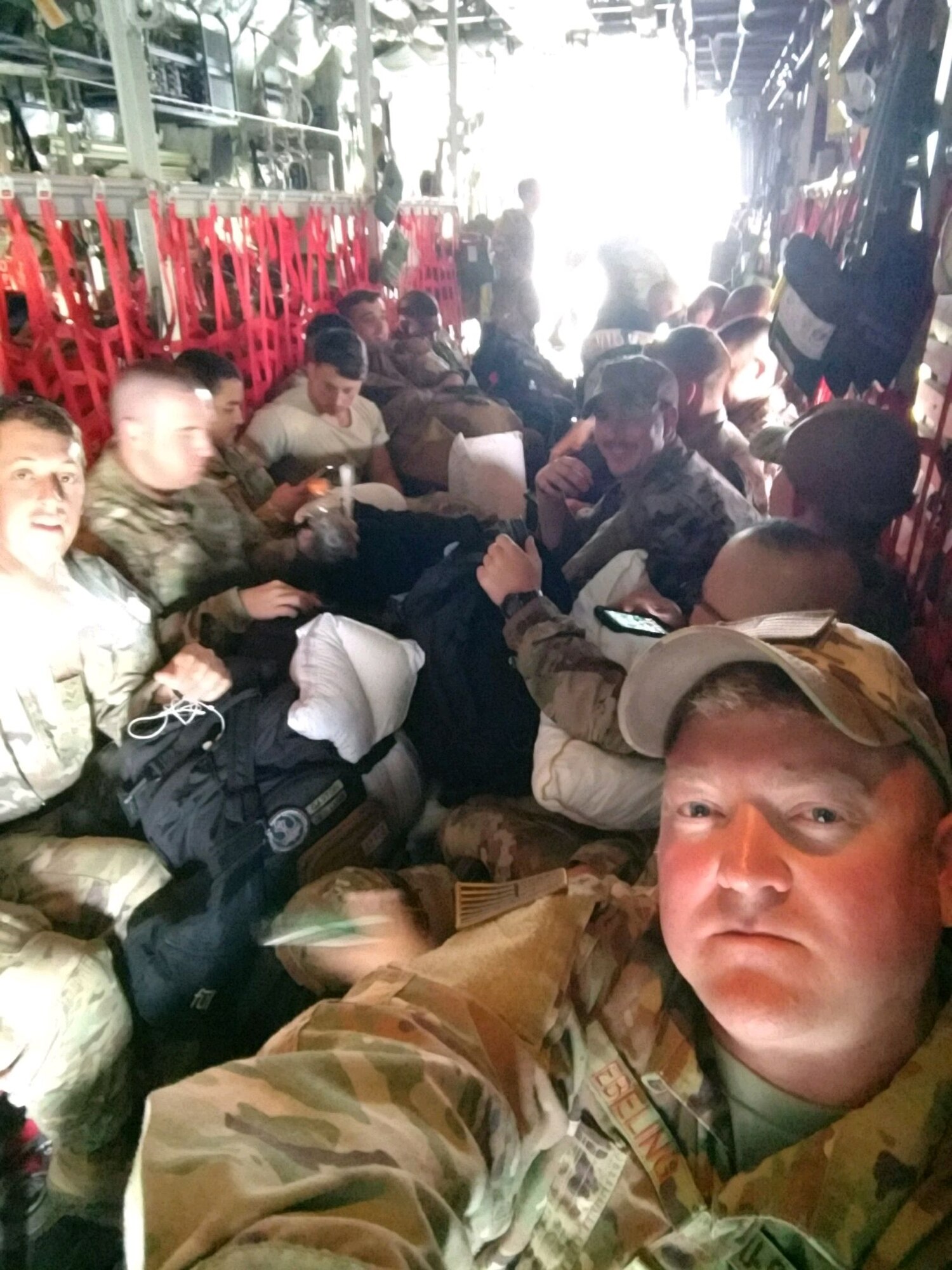Image of Master Sgt. Christopher Ebeling, 366th Security Forces superintendent of installations security, snaps a selfie with U.S. Air Force Security Forces from various bases on a C-17 Hercules in Djibouti, Africa. The Airmen were headed to Kenya. (Photo courtesy of Msgt. Christopher Ebeling)