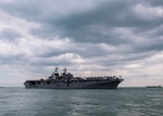 CHANGI, Singapore (Dec. 22, 2017) - The amphibious assault ship USS America (LHA 6) pulls in to RSS Singapura - Changi Naval Base, Singapore during a regularly scheduled port visit Dec. 22. America, part of the America Amphibious Ready Group, with embarked 15th Marine Expeditionary Unit, is operating in the Indo-Asia Pacific region to strengthen partnerships and serve as a ready-response force for any type of contingency.