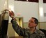 Tech. Sgt. Michael Marion, a cyber transport systems craftsman assigned to the 28th Communications Squadron, lights the menorah in the Freedom Chapel at Ellsworth Air Force Base, S.D., Dec. 19, 2017. The menorah, lit every night during Chanukah, commemorates the Jewish victory against Syrian-Greek oppressors in second-century B.C.E. (U.S. Air Force Photo by 2nd Lt. Daniel Rosenfield)